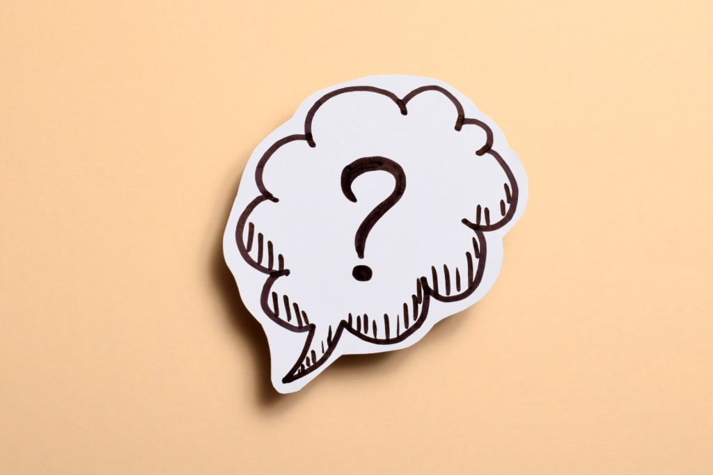 A question mark inside a speech bubble illustration on a beige background.